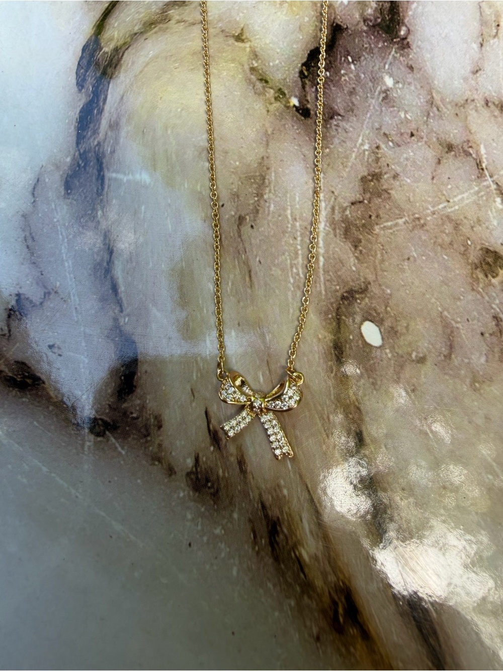 Francesca's Collections Gold Bow Necklace with Crystal Accents